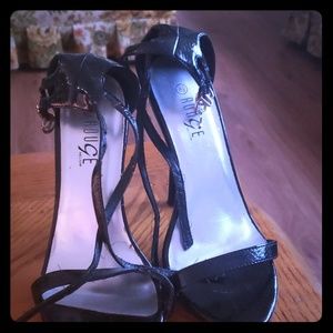 A pair of stapped heels
